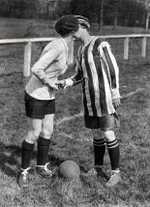 The team captains kiss before a match v France in 1920. Dick, Kerr Ladies in striped shirt